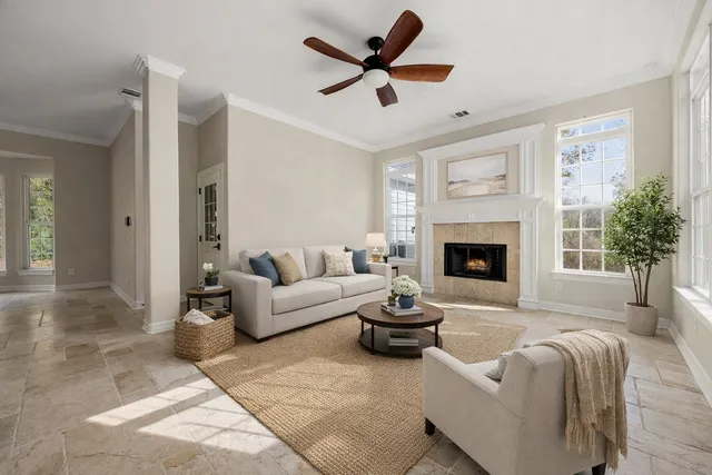 a living room with furniture and a fireplace