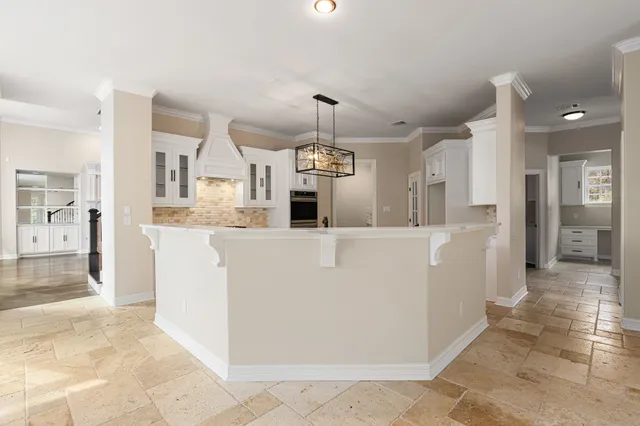 a view of a living room and kitchen