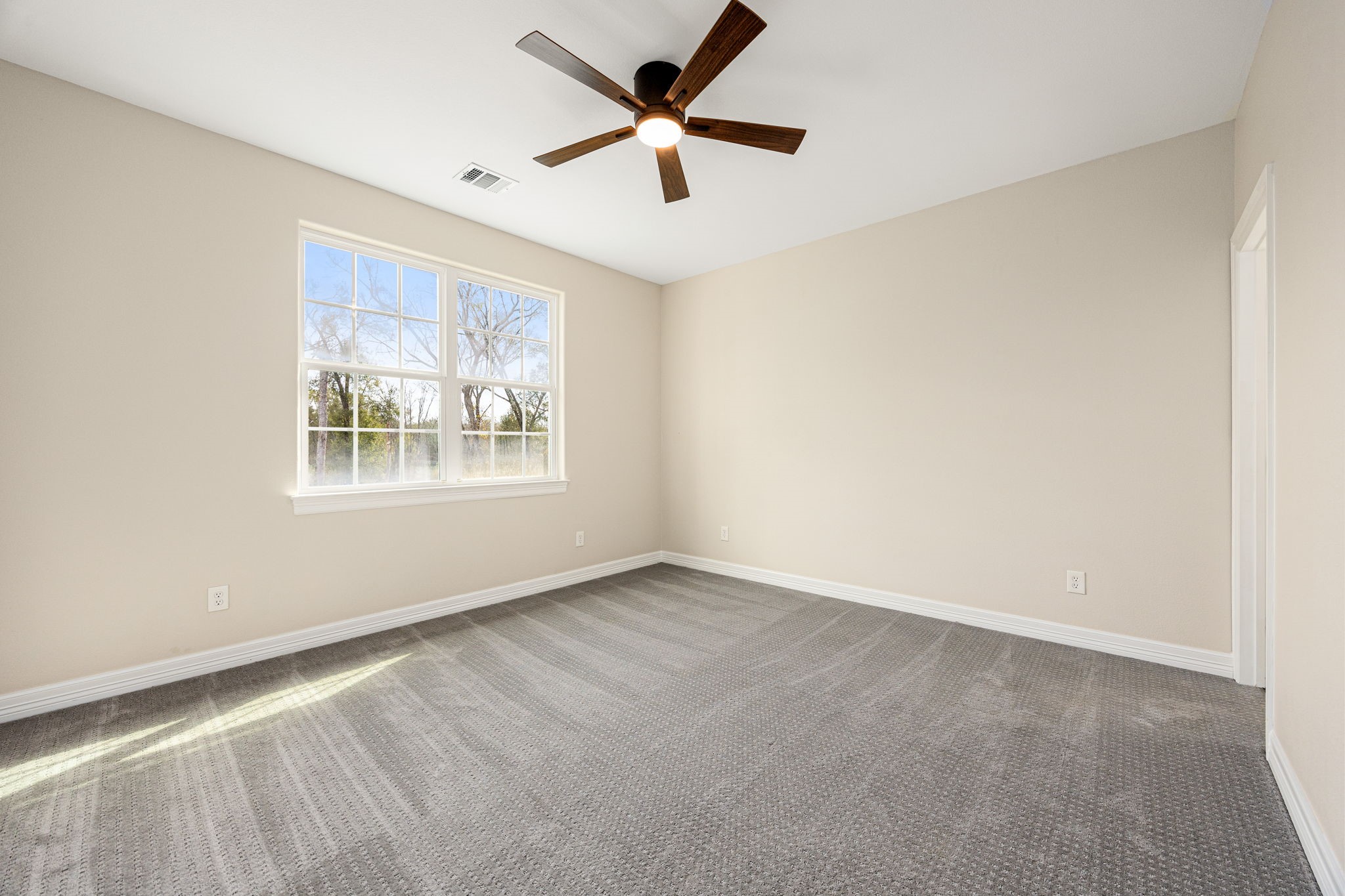 14882 Gingham Road Montgomery, TX 77356 - Photo 24 of 38 an empty room with windows and fan