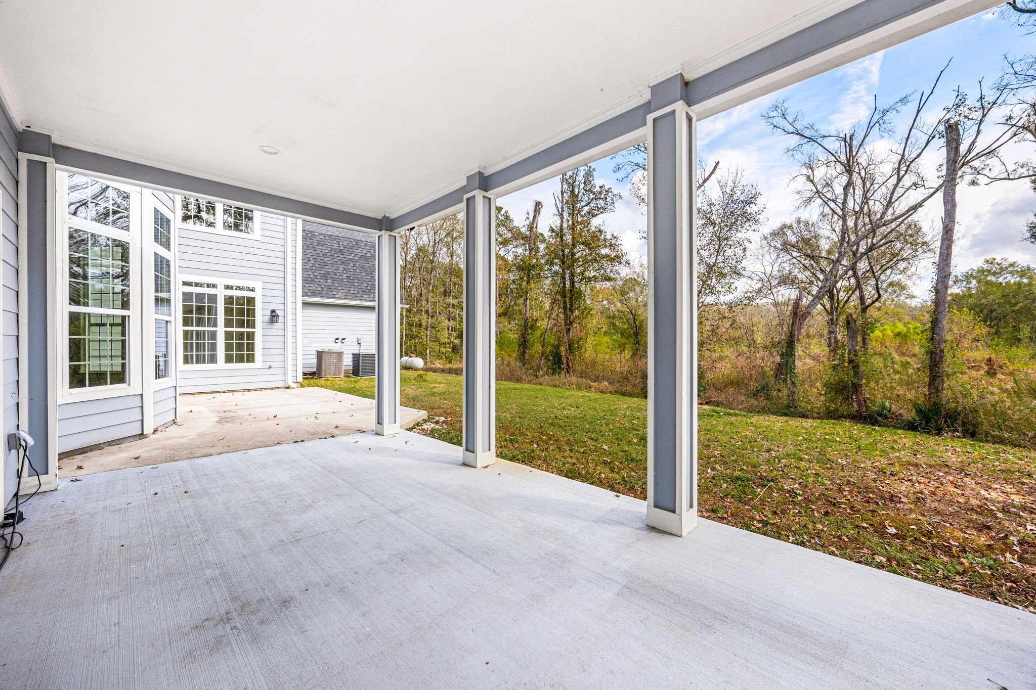 14882 Gingham Road Montgomery, TX 77356 - Photo 4 of 38 a view of a house with backyard and porch