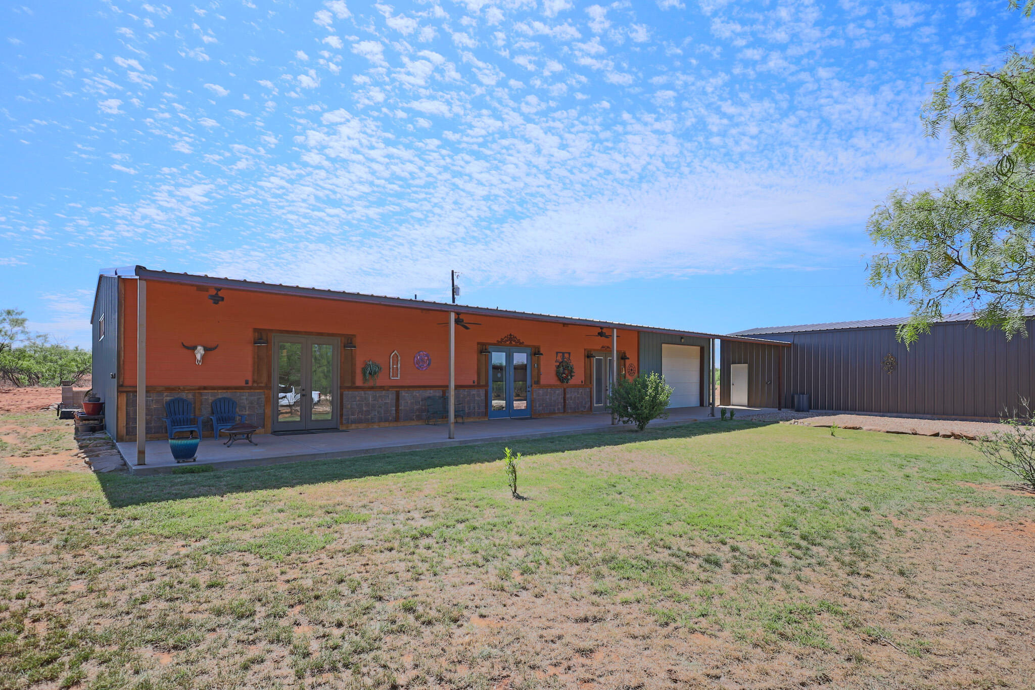 301 Fagan Road Snyder, TX 79549 - Photo 8 of 102 a backyard of a house with lots of green space