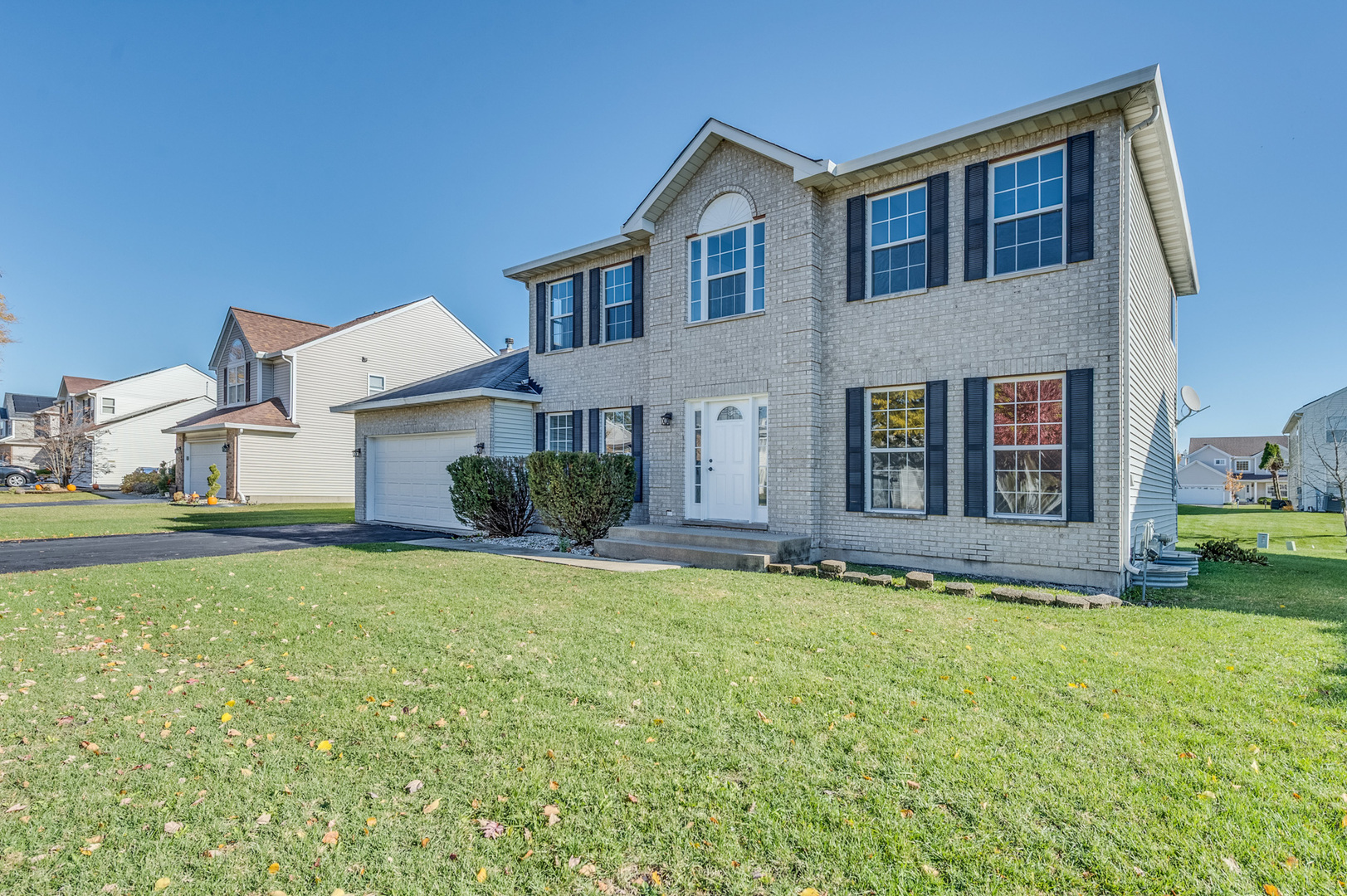 153 Treehouse Road Matteson, IL 60443 - Photo 2 of 19 a house that has a big yard in front of it