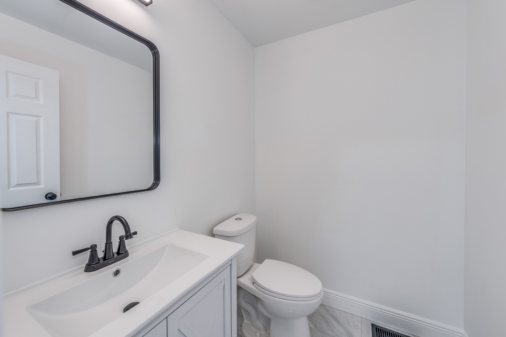 153 Treehouse Road Matteson, IL 60443 - Photo 5 of 19 a bathroom with a sink and a toilet