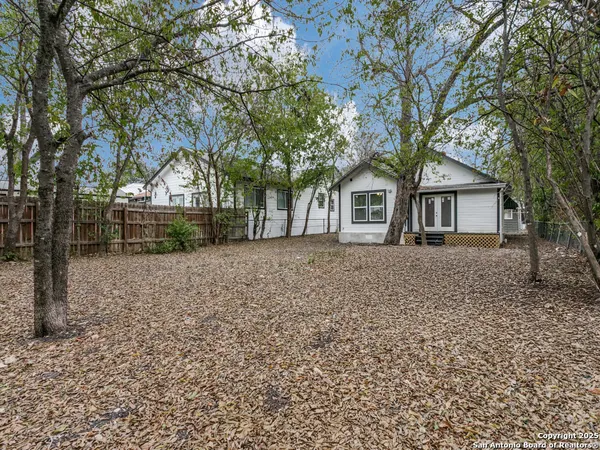 front view of house with a trees