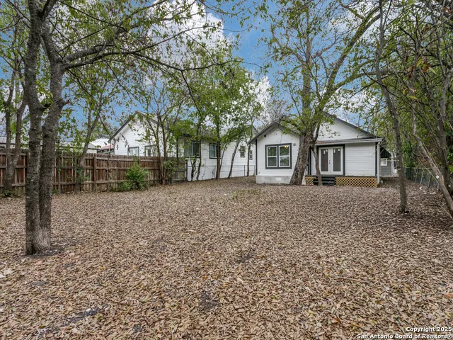 front view of house with a trees