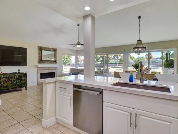 a kitchen with a sink and a fireplace