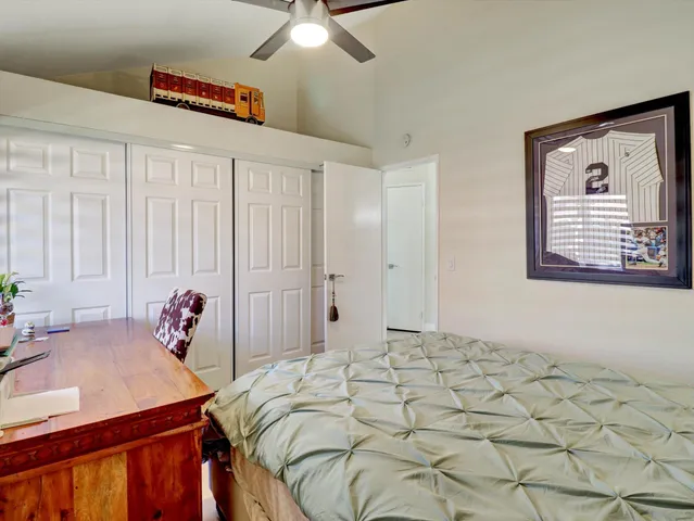 a bathroom with a granite countertop sink a shower and a mirror