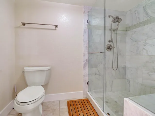 a view of a swimming pool with outdoor seating