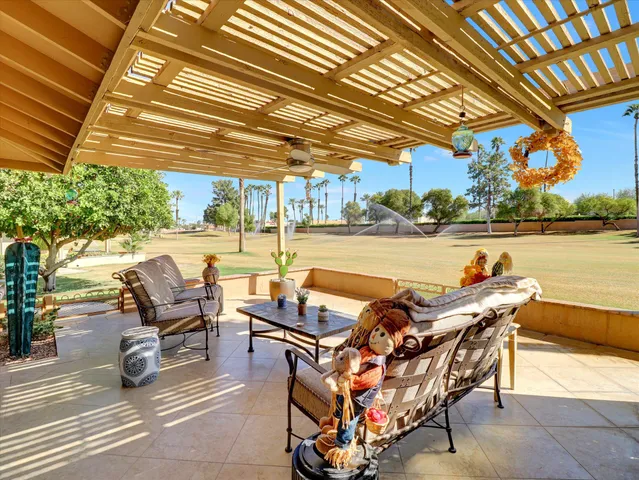 a view of a house with swimming pool and porch