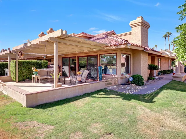 a view of a backyard with potted plants