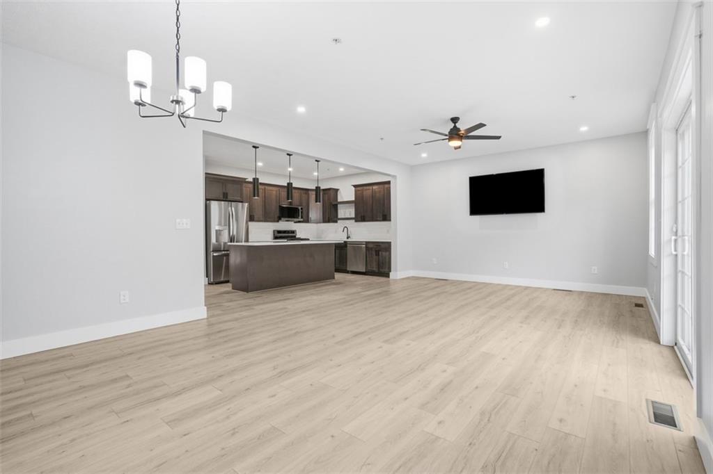 2339 Old Greentree Road Carnegie, PA 15106 - Photo 19 of 48 an empty room with kitchen and fireplace