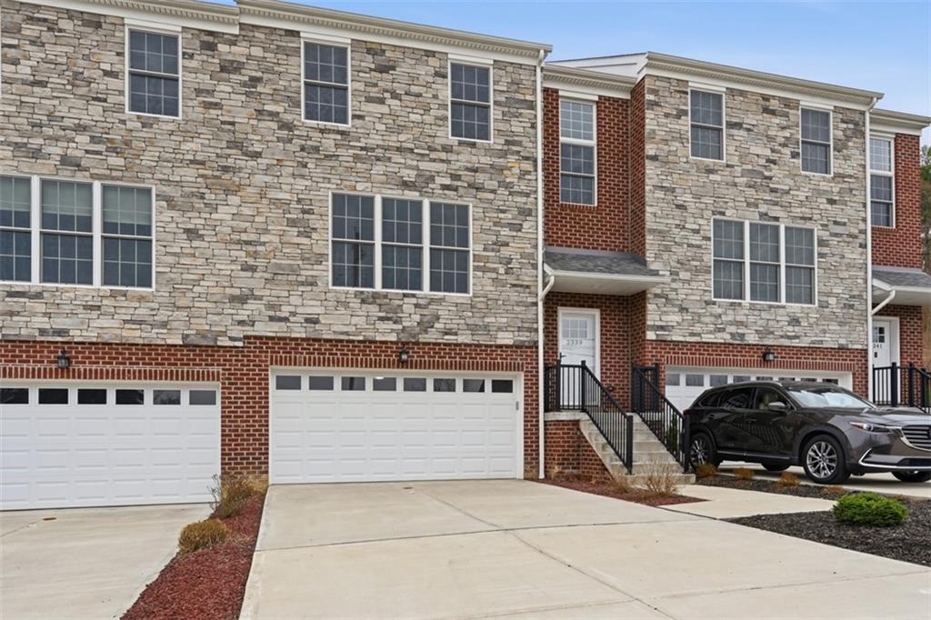 2339 Old Greentree Road Carnegie, PA 15106 - Photo 2 of 48 a front view of a building with parking space and windows