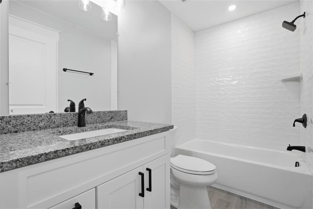 2339 Old Greentree Road Carnegie, PA 15106 - Photo 36 of 48 a bathroom with a granite countertop sink toilet and bathtub