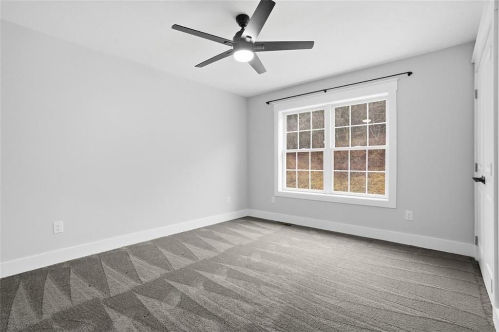 2339 Old Greentree Road Carnegie, PA 15106 - Photo 40 of 48 a view of an empty room with a window and wooden floor