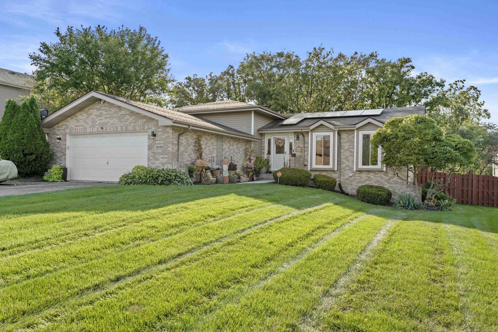 3686 Ronald Road Crete, IL 60417 - Photo 1 of 35 a view of a house with a yard and large trees