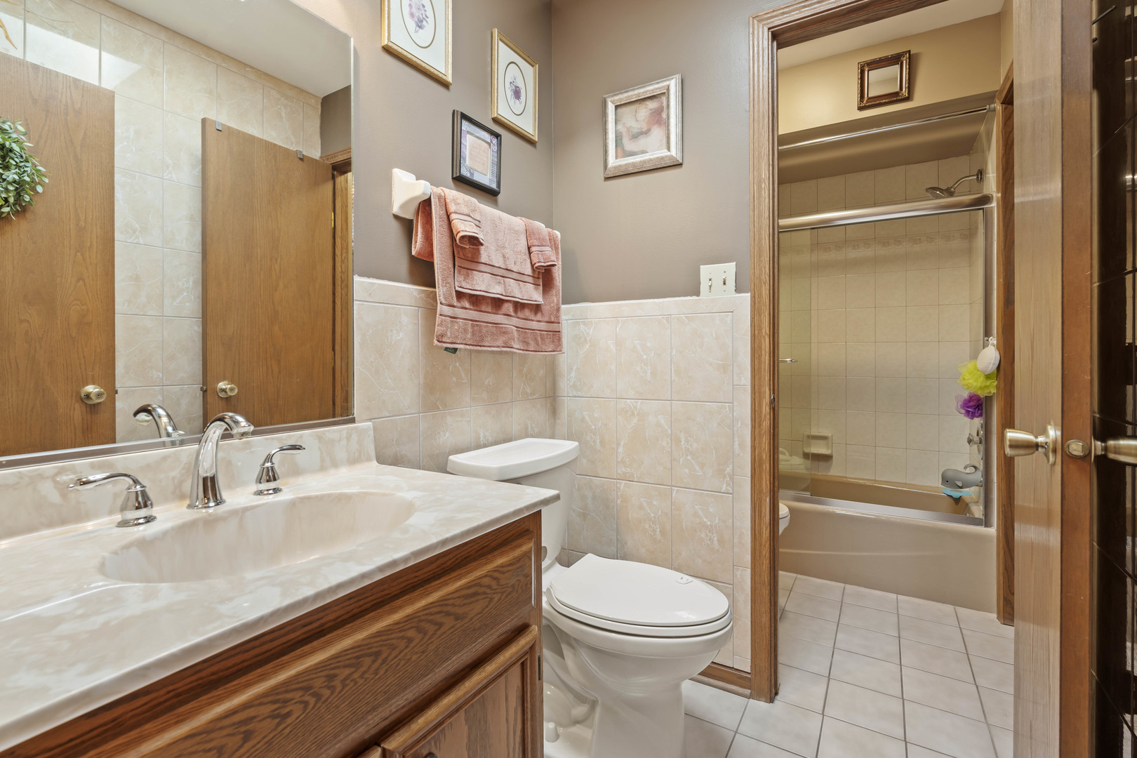 3686 Ronald Road Crete, IL 60417 - Photo 15 of 35 a bathroom with a sink a toilet and shower