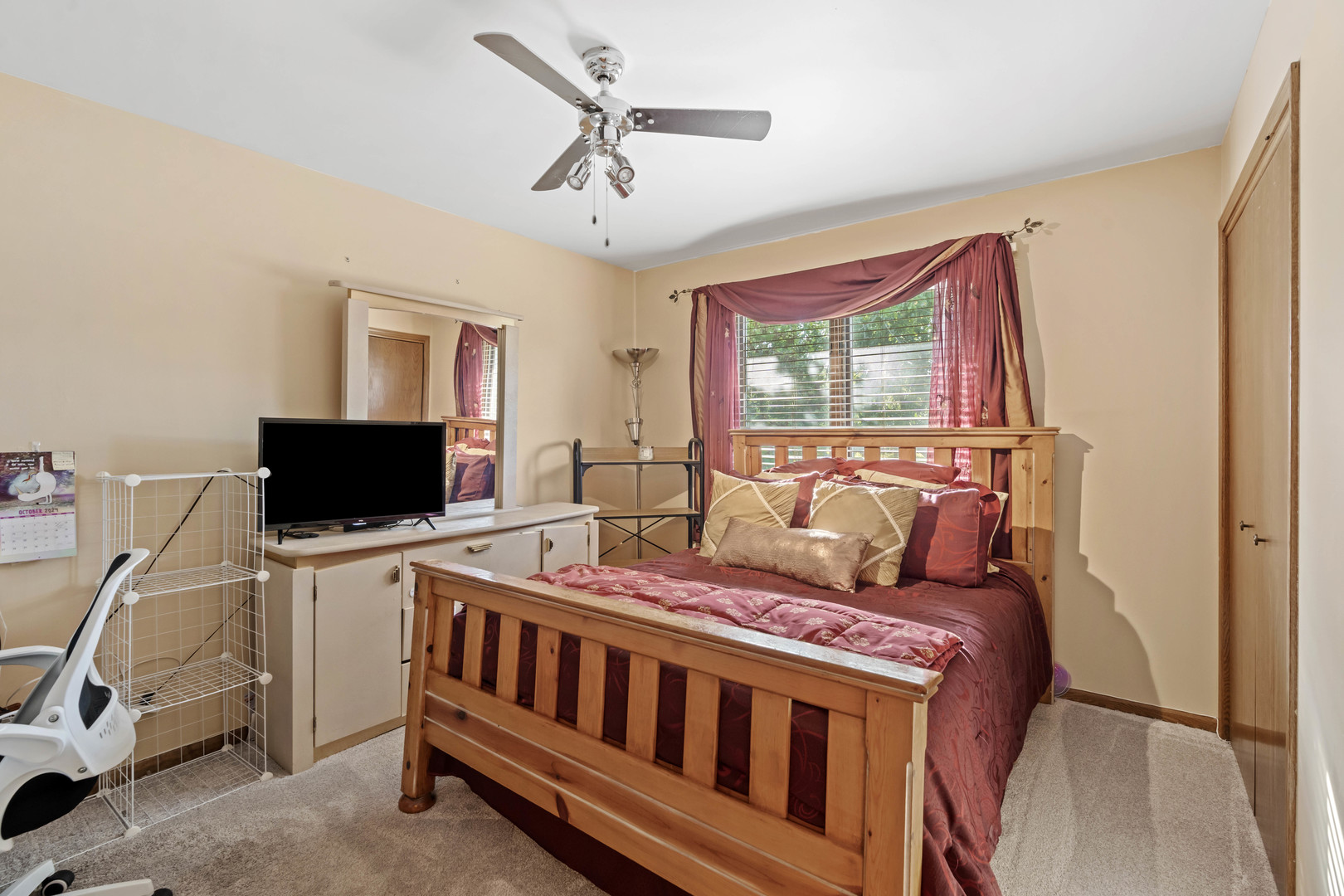 3686 Ronald Road Crete, IL 60417 - Photo 18 of 35 a bedroom with furniture and a flat screen tv