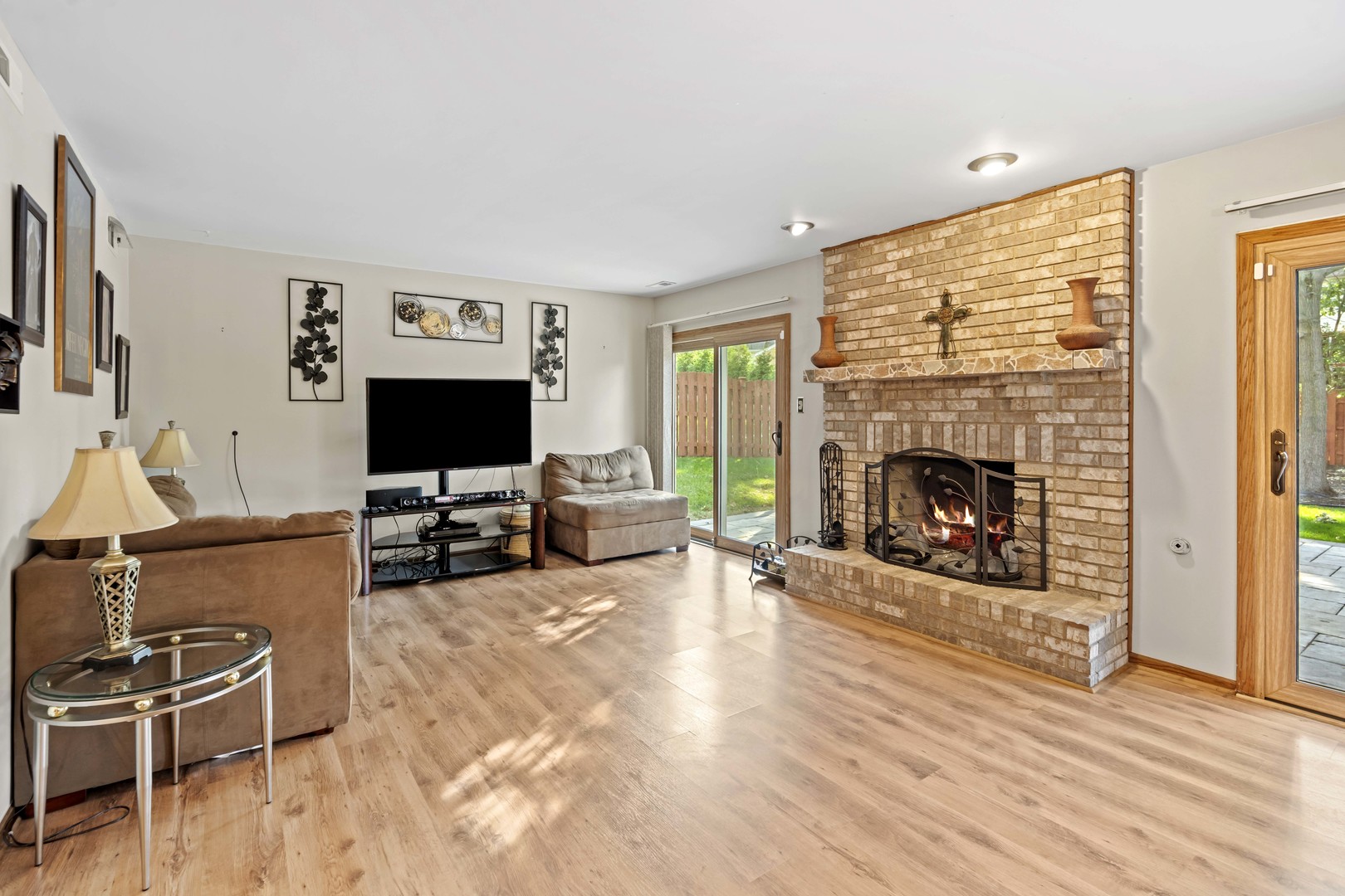 3686 Ronald Road Crete, IL 60417 - Photo 22 of 35 a living room with furniture flat screen tv and a fireplace
