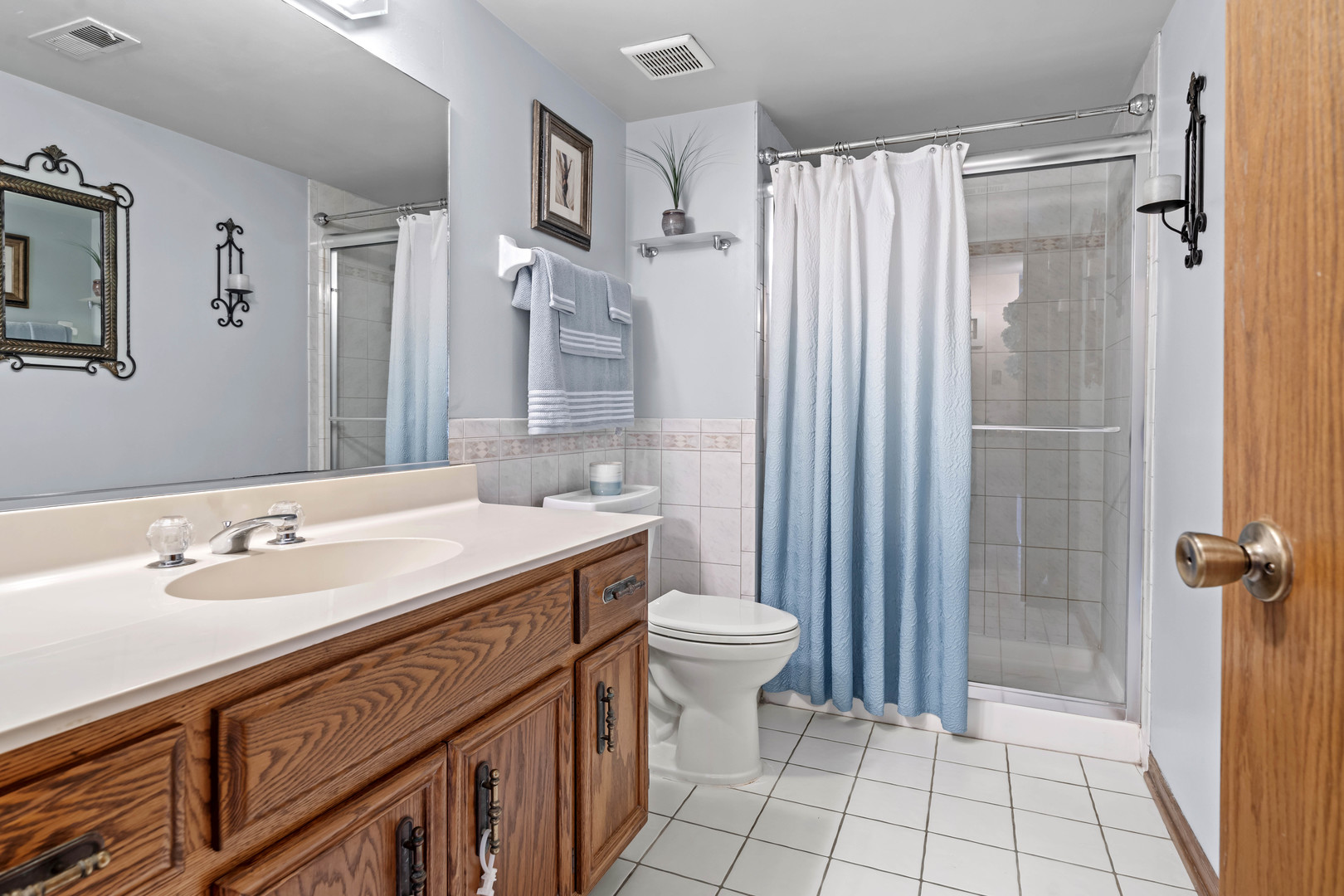 3686 Ronald Road Crete, IL 60417 - Photo 23 of 35 a bathroom with a sink a toilet and shower