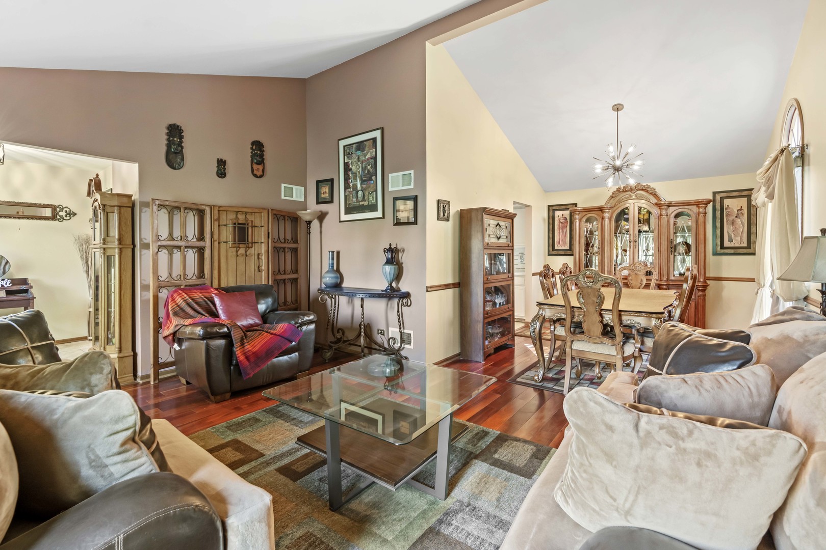 3686 Ronald Road Crete, IL 60417 - Photo 5 of 35 a living room with patio furniture and a chandelier