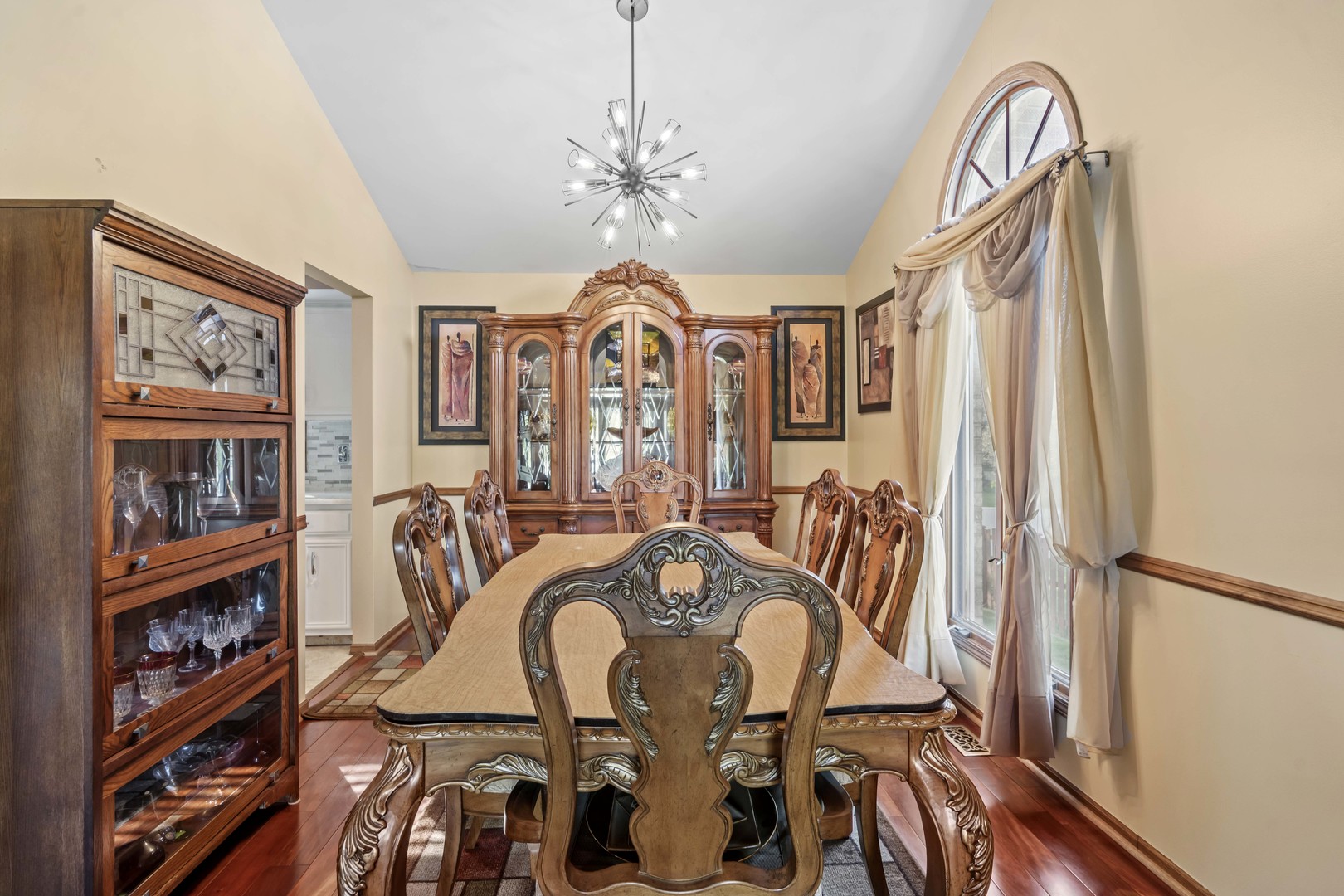 3686 Ronald Road Crete, IL 60417 - Photo 7 of 35 a view of a balcony with furniture and a chandelier