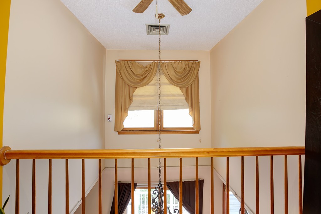 3 Jennifer Road Lowell, MA 01854 - Photo 11 of 25 a bathroom with a window and a chandelier