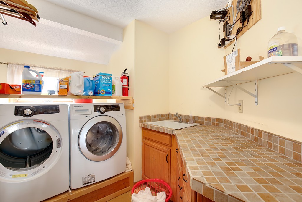 3 Jennifer Road Lowell, MA 01854 - Photo 12 of 25 a utility room with dryer and washer