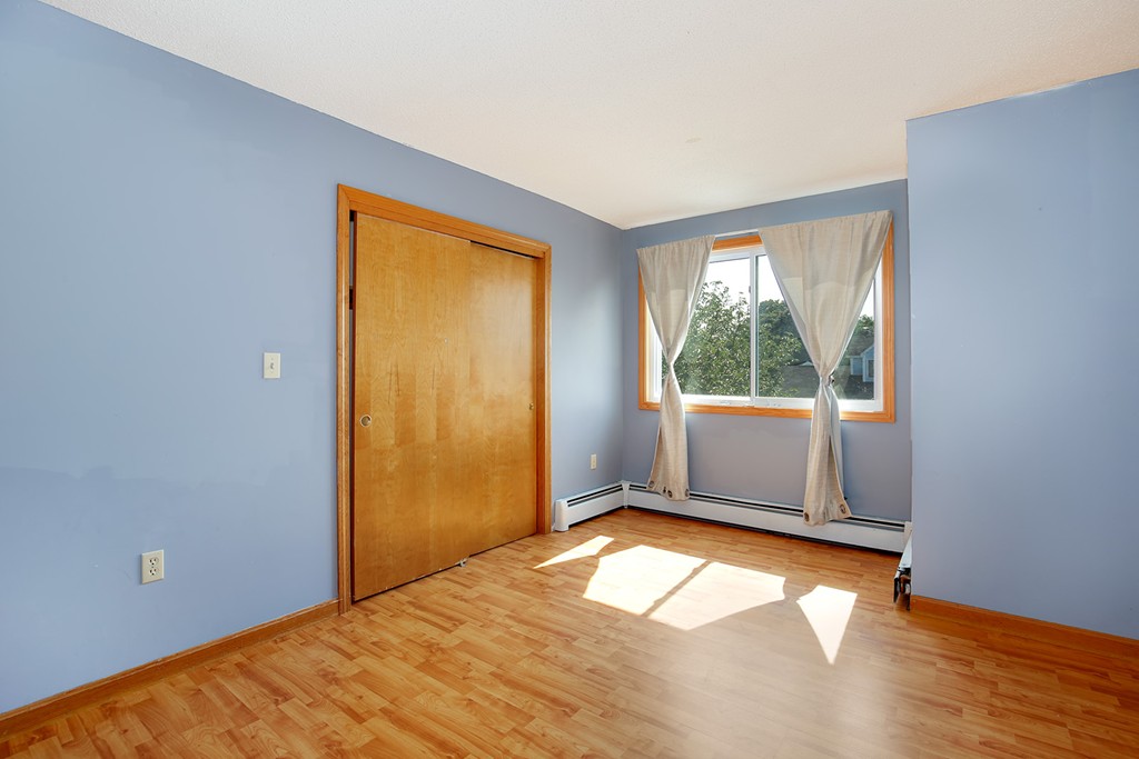 3 Jennifer Road Lowell, MA 01854 - Photo 15 of 25 a view of empty room with wooden floor and fan