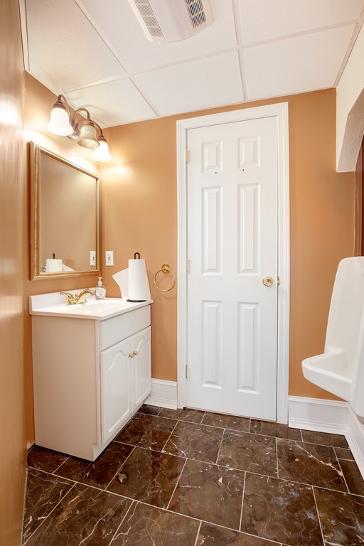 3 Jennifer Road Lowell, MA 01854 - Photo 22 of 25 a bathroom with a sink and a mirror