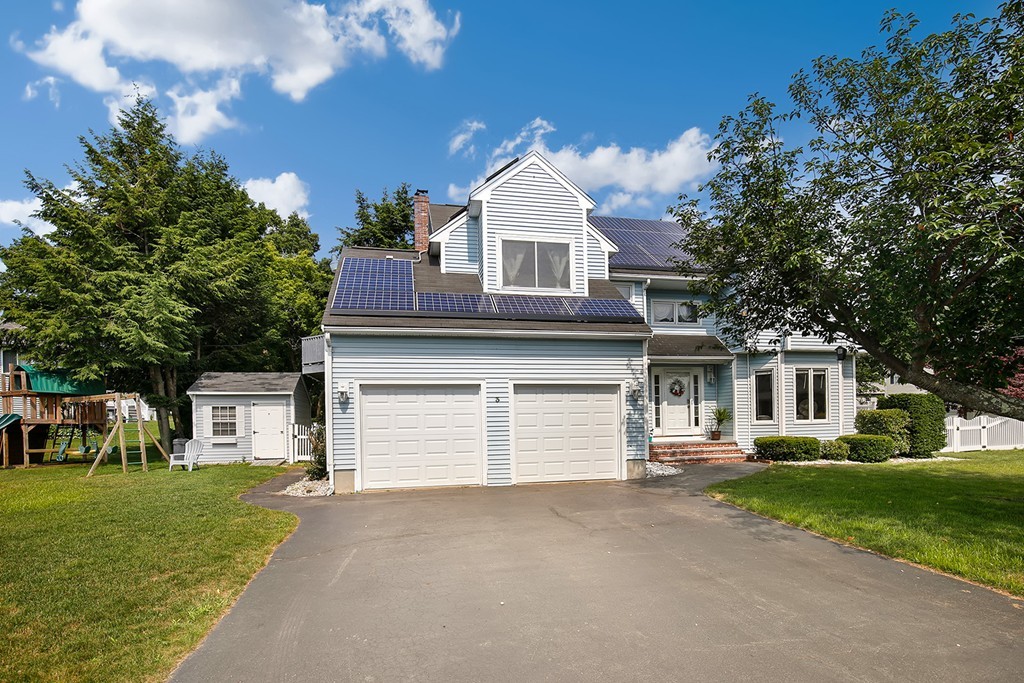3 Jennifer Road Lowell, MA 01854 - Photo 25 of 25 a front view of a house with a yard and garage