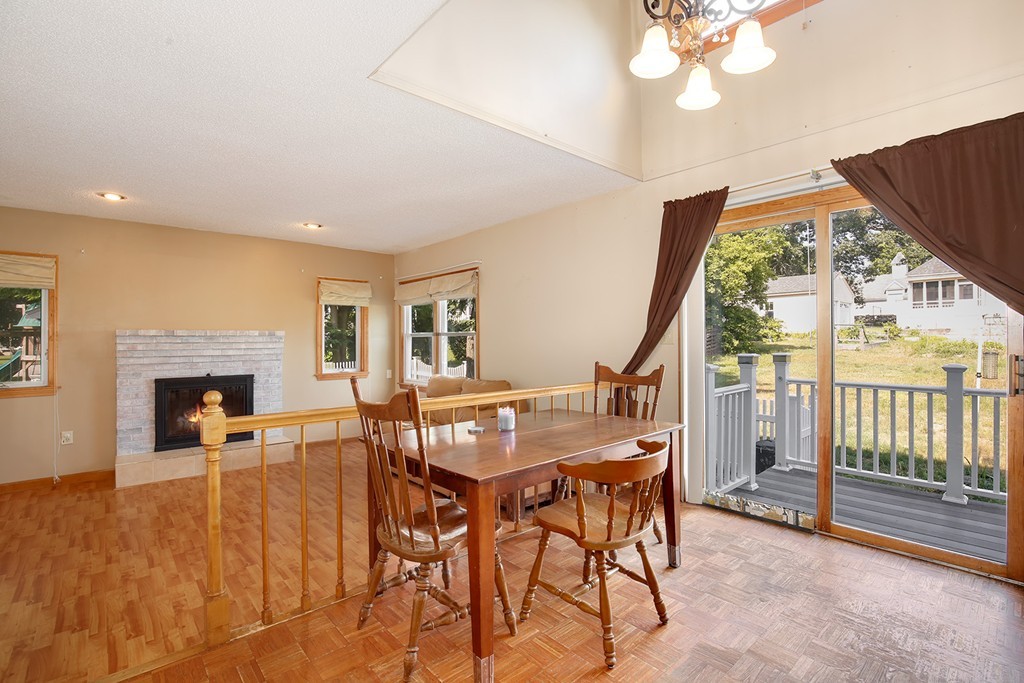 3 Jennifer Road Lowell, MA 01854 - Photo 5 of 25 a view of a livingroom with furniture fireplace and dining room