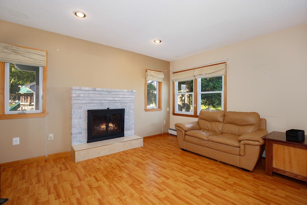 3 Jennifer Road Lowell, MA 01854 - Photo 6 of 25 a living room with furniture and a fireplace