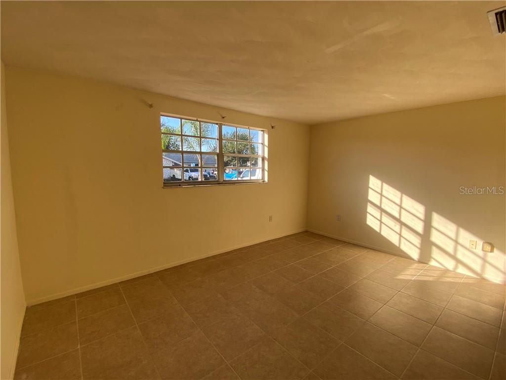 3612 Springfield Drive Holiday, FL 34691 - Photo 9 of 13 an empty room with windows