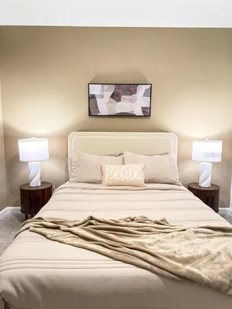 a bedroom with a bed and a couch