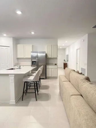 a living room with furniture and window