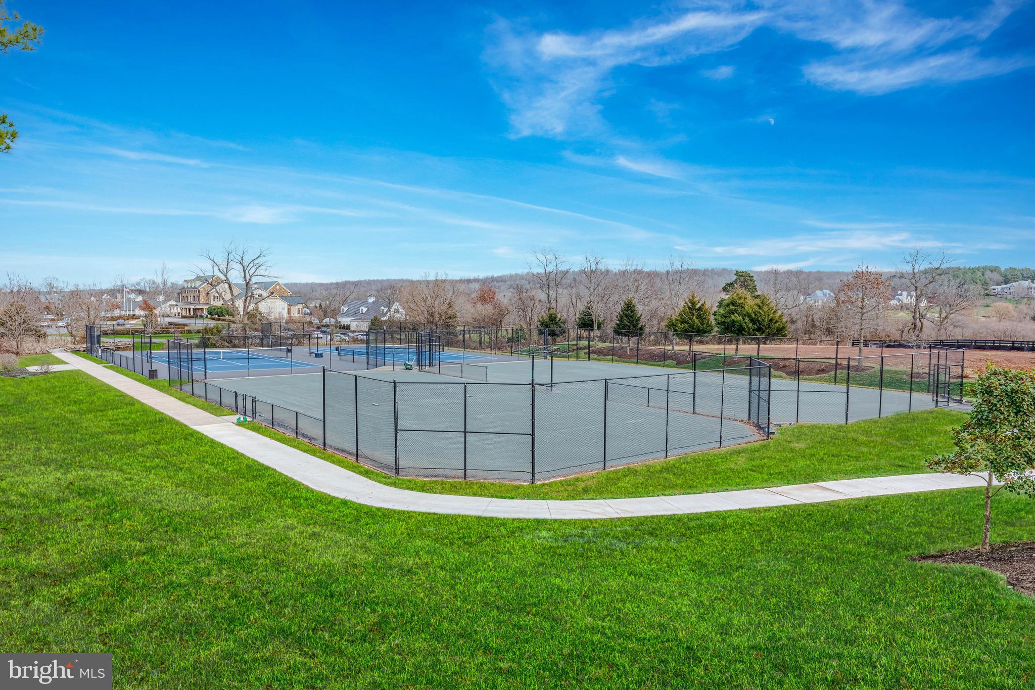 40174 Monroe Valley Place Aldie, VA 20105 - Photo 23 of 34 a view of a yard with a fence and trees in the background
