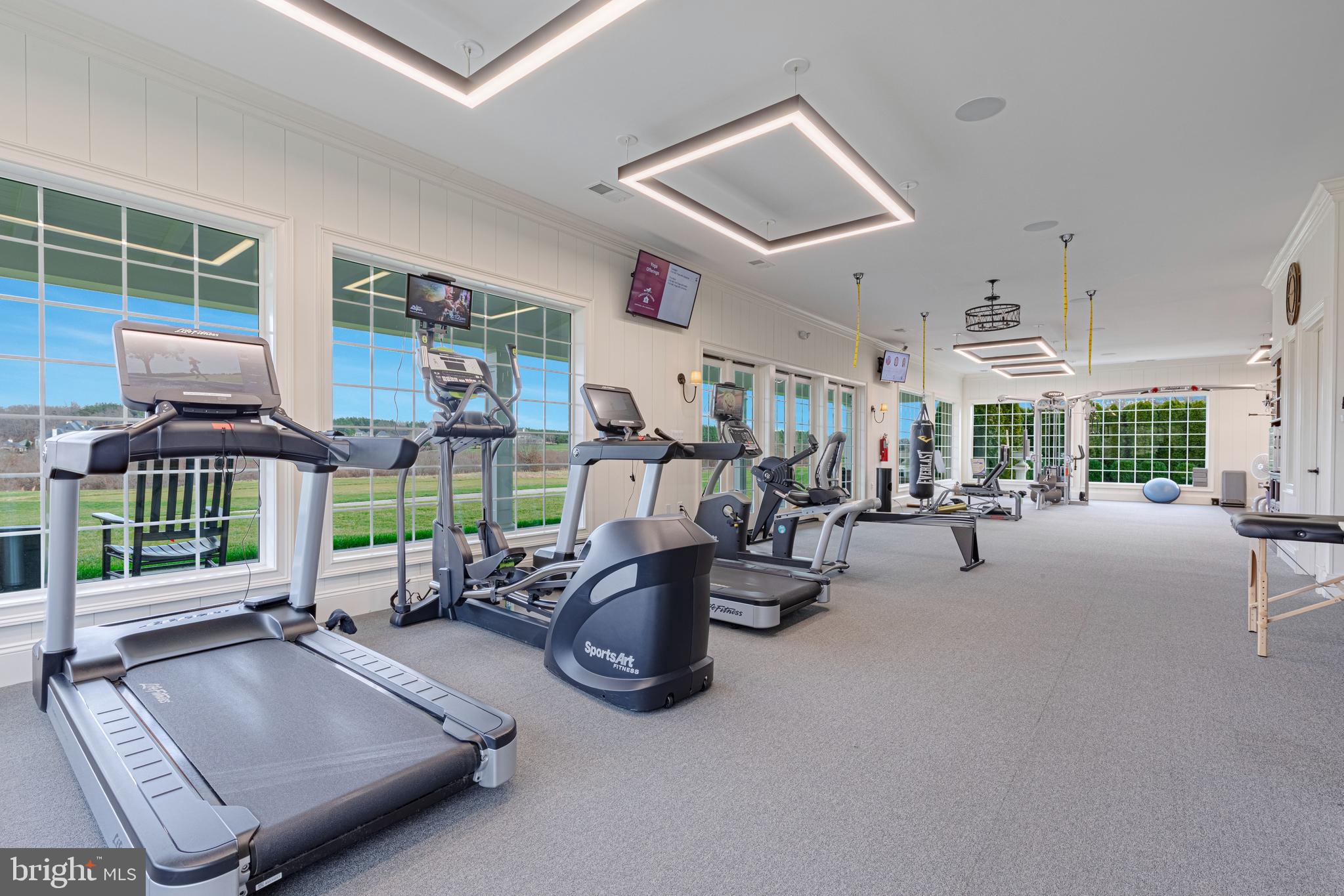 40174 Monroe Valley Place Aldie, VA 20105 - Photo 30 of 34 a room with gym equipment and a large window