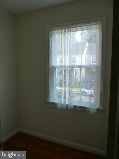 6754 Towne Lane Road McLean, VA 22101 - Photo 8 of 15 a view of a small space with wooden floor and a window
