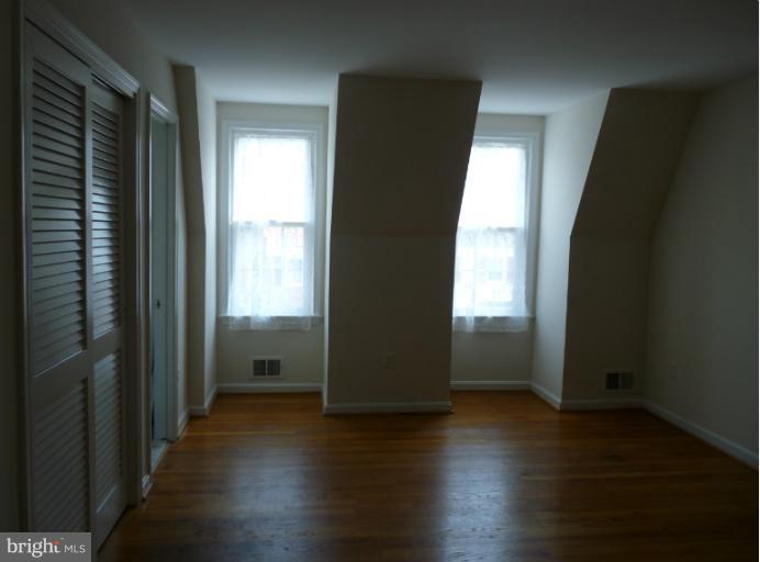6754 Towne Lane Road McLean, VA 22101 - Photo 10 of 15 an empty room with wooden floor and windows