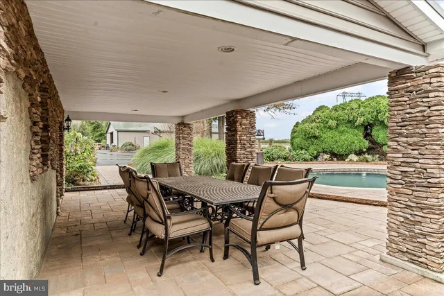 a balcony with furniture and wooden floor