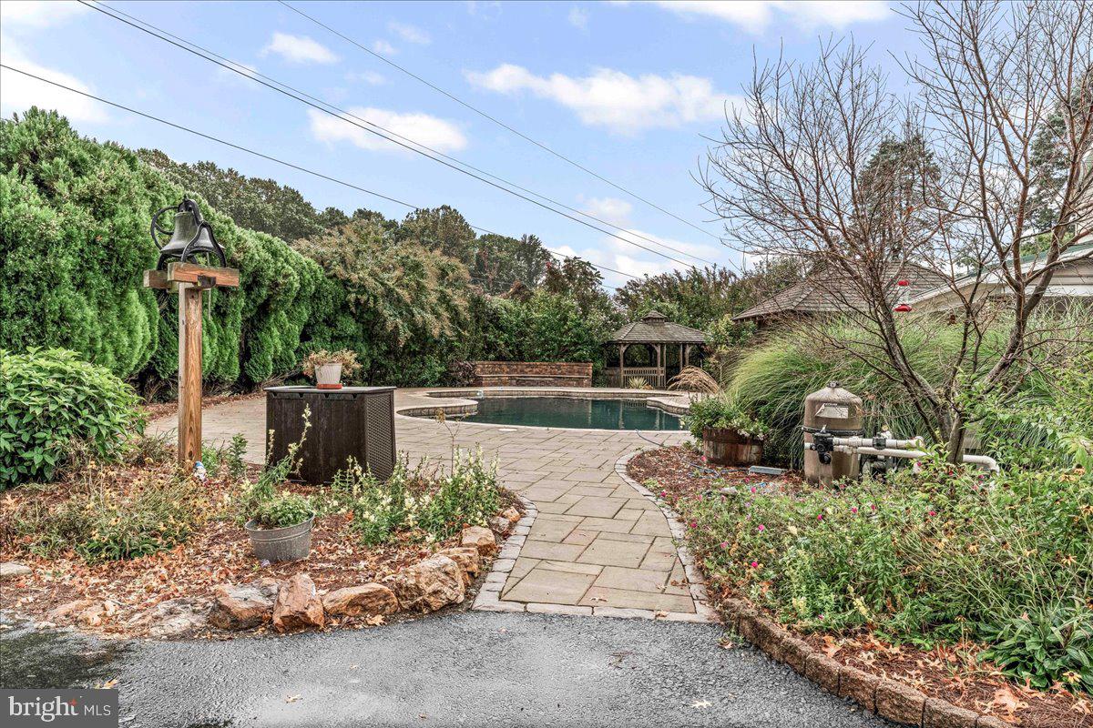 756 Ewing Road Cochranville, PA 19330 - Photo 14 of 73 a view of a garden with potted plants