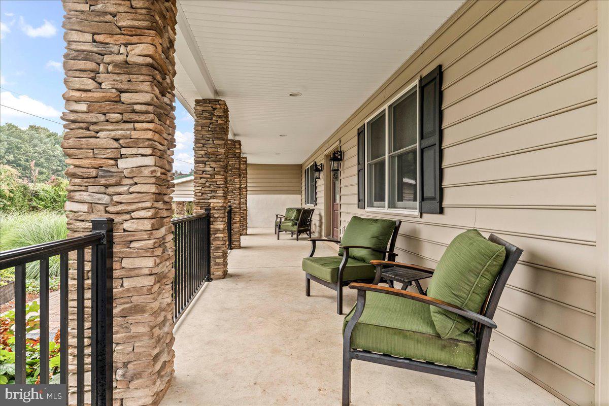 756 Ewing Road Cochranville, PA 19330 - Photo 18 of 73 a balcony with furniture and a potted plant