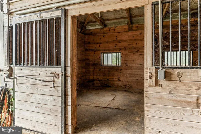 a large kitchen with stainless steel appliances lots of counter space and wooden floor