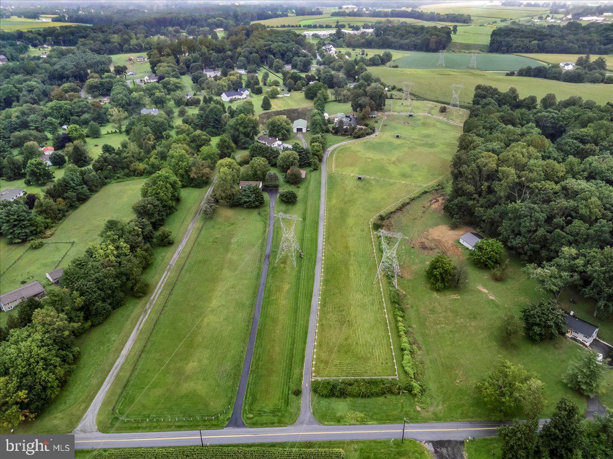 756 Ewing Road Cochranville, PA 19330 - Photo 27 of 73 an aerial view of residential houses with outdoor space and trees