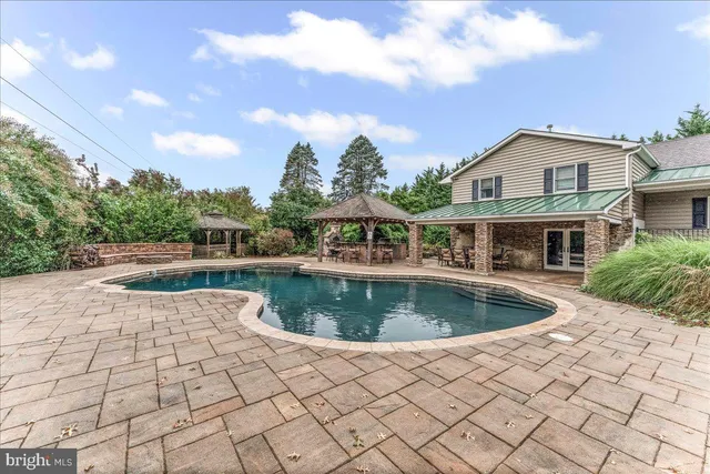 a view of a chairs and table in the patio