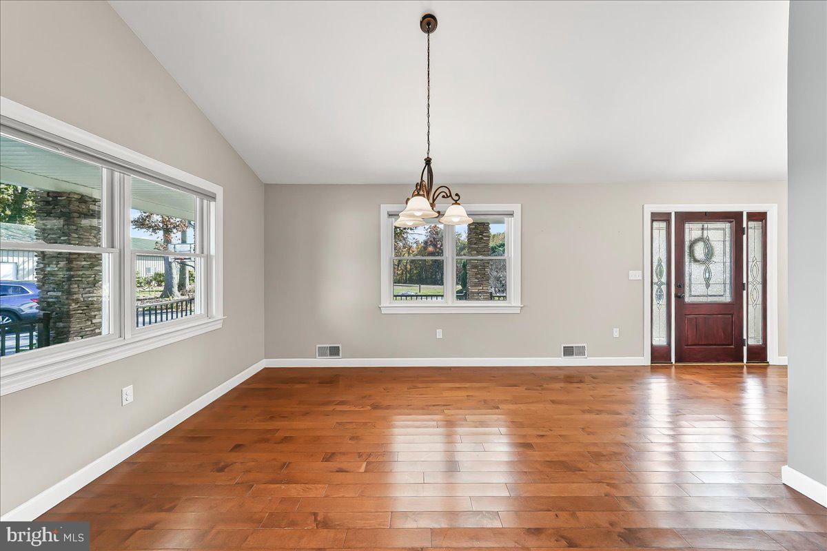 756 Ewing Road Cochranville, PA 19330 - Photo 33 of 73 a view of an empty room with window and wooden floor