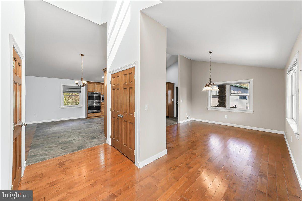 756 Ewing Road Cochranville, PA 19330 - Photo 34 of 73 a view of a kitchen with wooden floor and a refrigerator