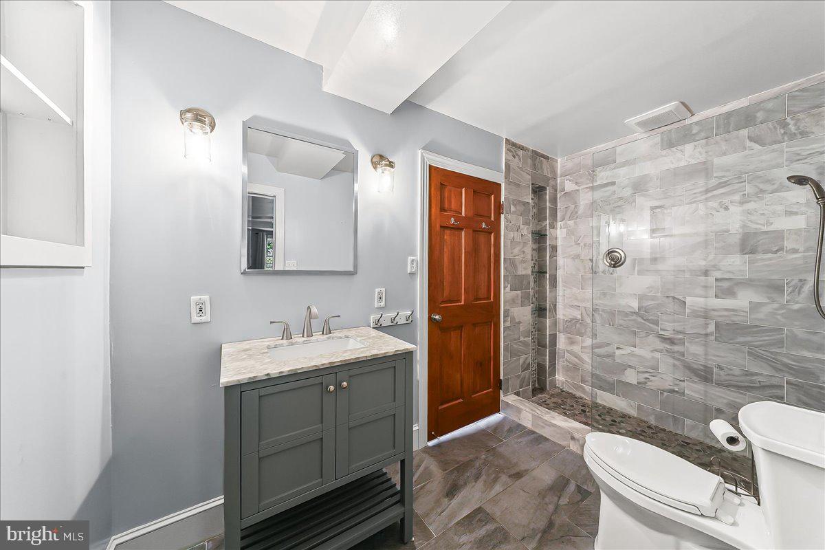 756 Ewing Road Cochranville, PA 19330 - Photo 62 of 73 a bathroom with a sink a toilet and shower