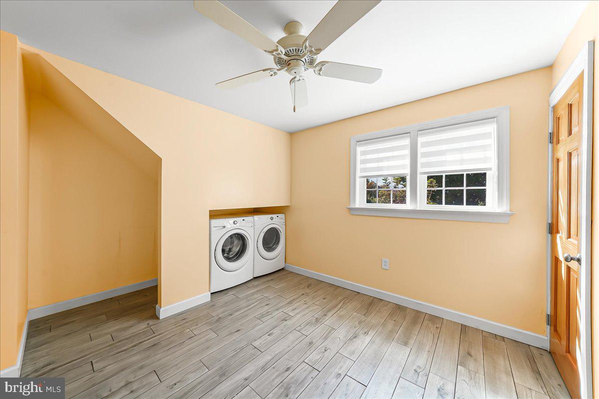 756 Ewing Road Cochranville, PA 19330 - Photo 64 of 73 a view of a livingroom with wooden floor and white walls