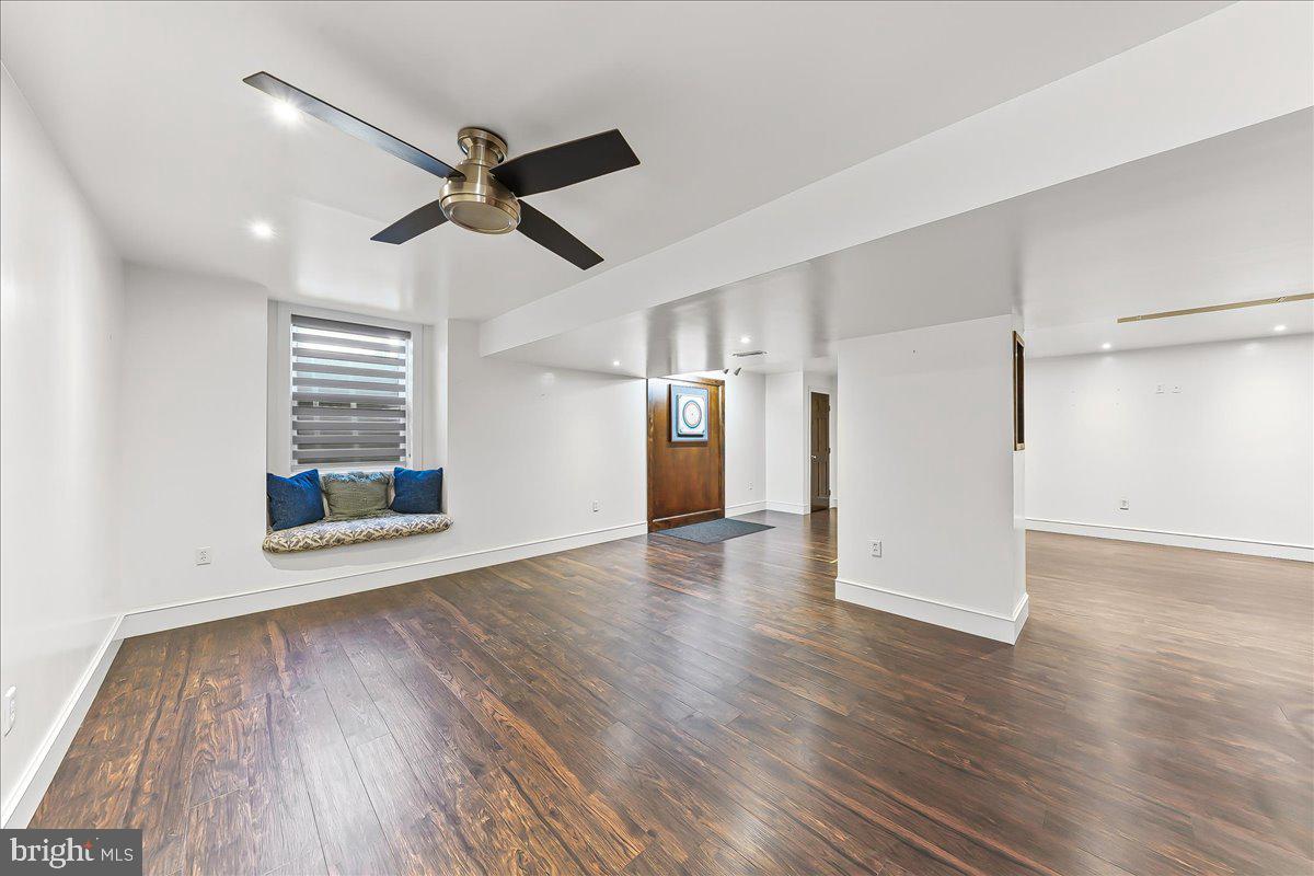 756 Ewing Road Cochranville, PA 19330 - Photo 68 of 73 a view of an empty room with wooden floor and a window